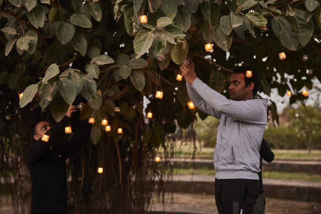 Students Putting Lamps on Bodhi Tree